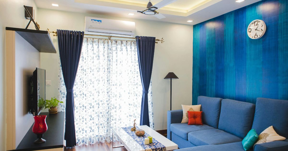 Budget living room decoration ideas for Indian homes with accent wall and sofa styling